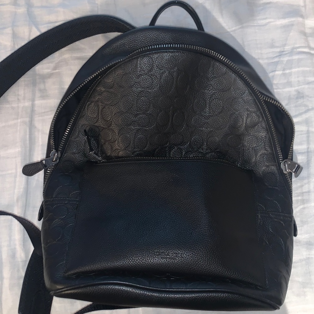 All black Mens Coach bag 100% real black leather. Great and very durable bag.